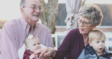 elderly couple with family